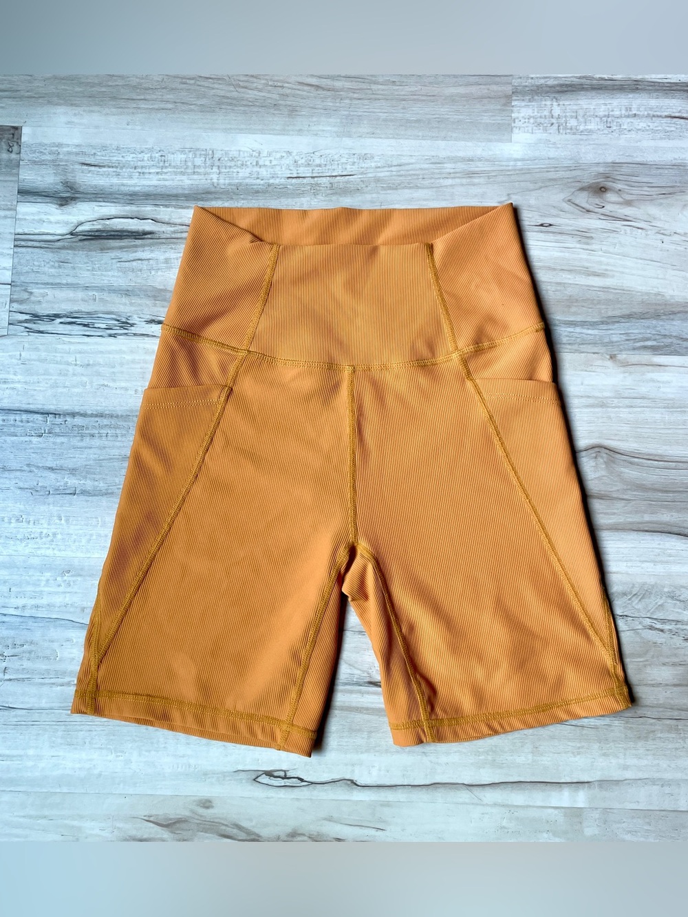 Wilo The Label High-Waist Bike Shorts in Orange crème color, ribbed size medium